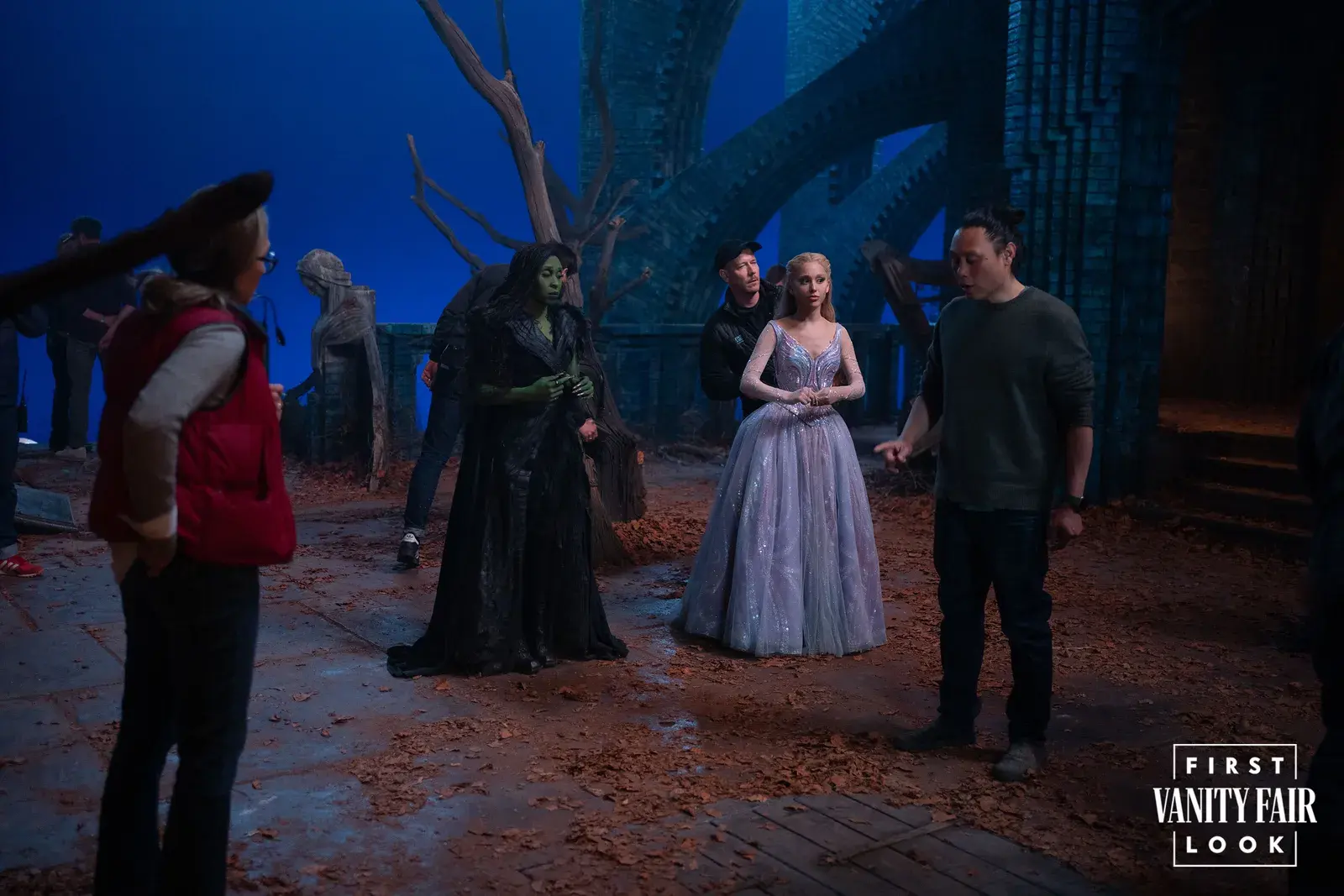 First Look at 'Wicked: For Good' Trailer 1 From left to right: Cynthia Erivo, Ariana Grande, and Jon M. Chu on the set of Wicked: For Good. (Image Source: Giles Keyte/Universal Pictures)