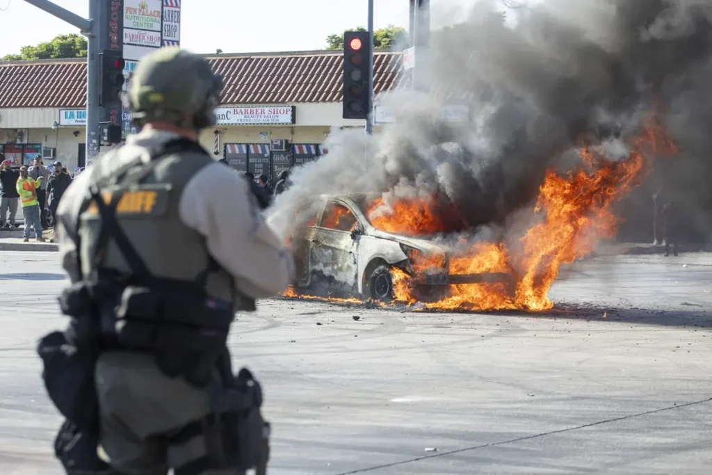 Law enforcement clashes with LA riot demonstrators during a protest following federal immigration operations, in Compton, California on June 7, 2025. (Credit: Getty Images)