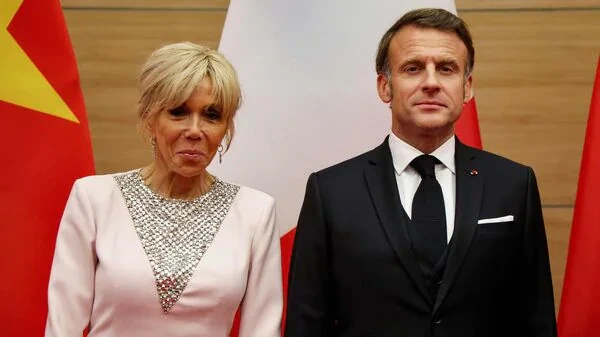 French President Macron Slapped During Visit to Vietnam 1 France's First Lady Brigitte Macron and Emmanuel Macron during their visit to Hanoi, Vietnam. (Image Credit: AFP)