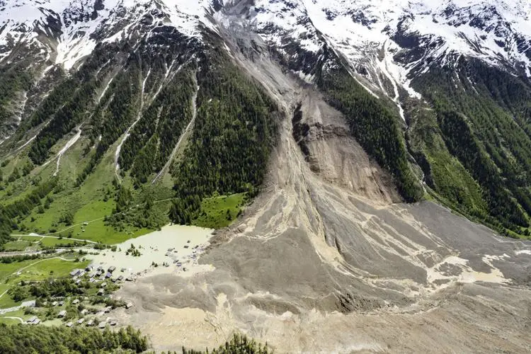 Catastrophic Glacier Collapse Buries 90% of Village in Switzerland 1 Aerial view shows the destruction of the Swiss glacier collapse, Thursday, May 29, 2025, one day after a massive debris avalanche, triggered by the collapse of the Birch Glacier, swept down to the valley floor and demolished large parts of the village. (Image Credit: JEAN-CHRISTOPHE BOTT / Keystone)