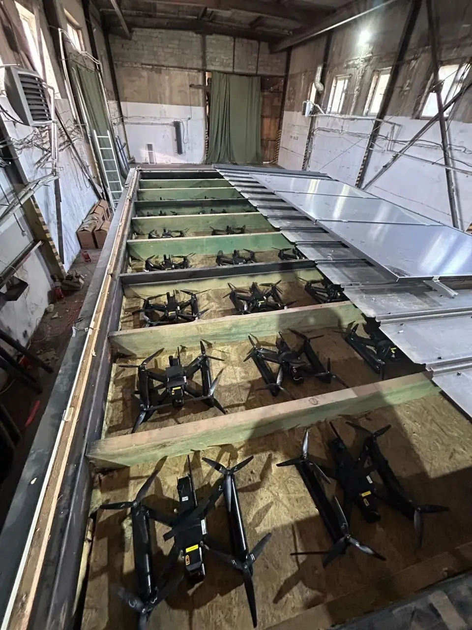 Latest Ukraine Drone Attack Destroys Over 40 Russian Bombers 2 The drones were concealed in the ceilings of transportation containers that were opened remotely for the assault. (Image Credit: SECURITY SERVICE OF UKRAINE/AFP)