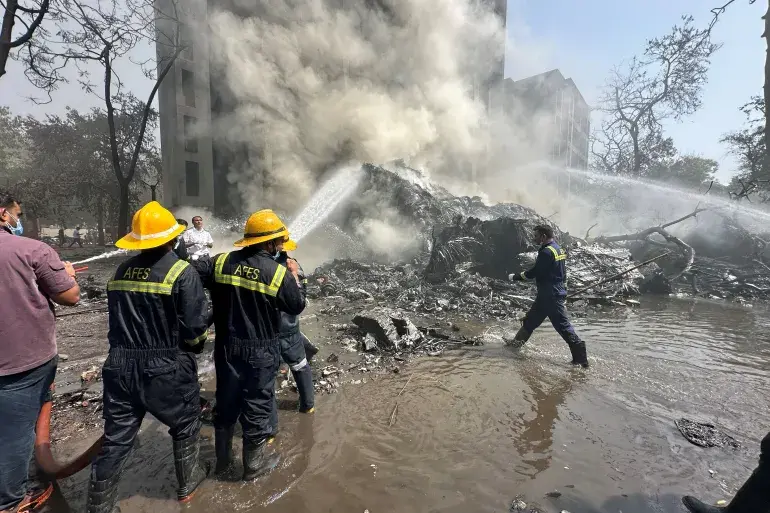 Air India Plane Crashes Minutes After Take Off at Ahmedabad Airport 1 Rescuers work as smoke rises at the site where an Air India plane crashed in Ahmedabad, India, on June 12, 2025 (Image Credit: Amit Dave/Reuters)