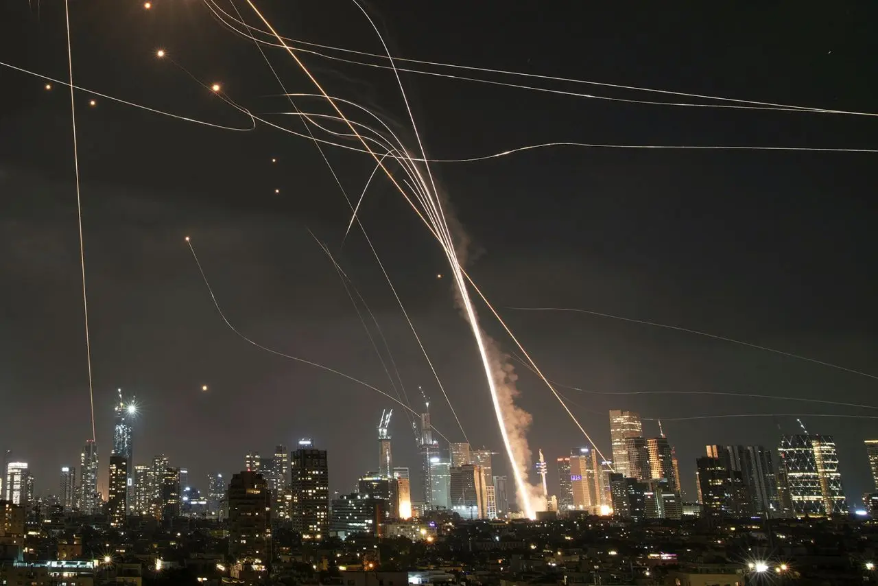 Iran Retaliates with Missile Strikes After Israeli Assault on Nuclear Sites 1 Israeli Iron Dome air defense system at work to intercept missiles over Tel Aviv, Israel, on Friday. (Image Credit: Leo Correa/AP)