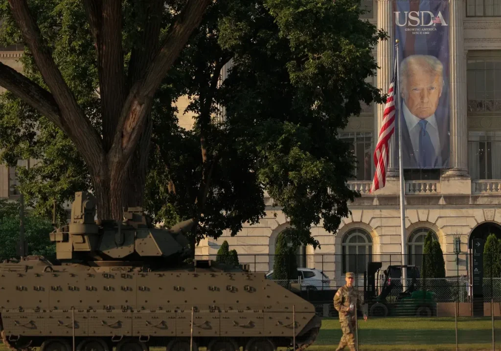 Banner of President Donald Trump hangs ahead of this weekend's Military Parade in Washington, DC. (Credit: Chip Somodevilla/Getty Images)