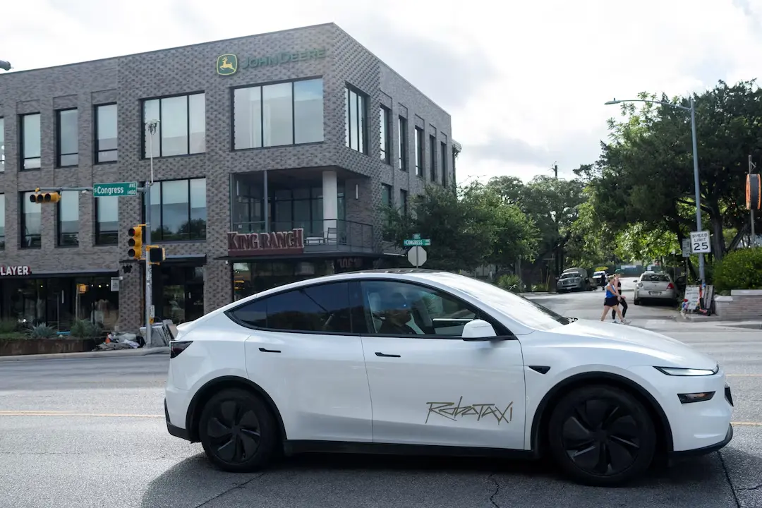 Tesla Robotaxi Are Here - Rolls Out in Austin, Texas 1 A Tesla robotaxi drives on the street along South Congress Avenue in Austin, Texas, U.S., June 22, 2025. (Image Credit: REUTERS/Joel Angel Juarez)
