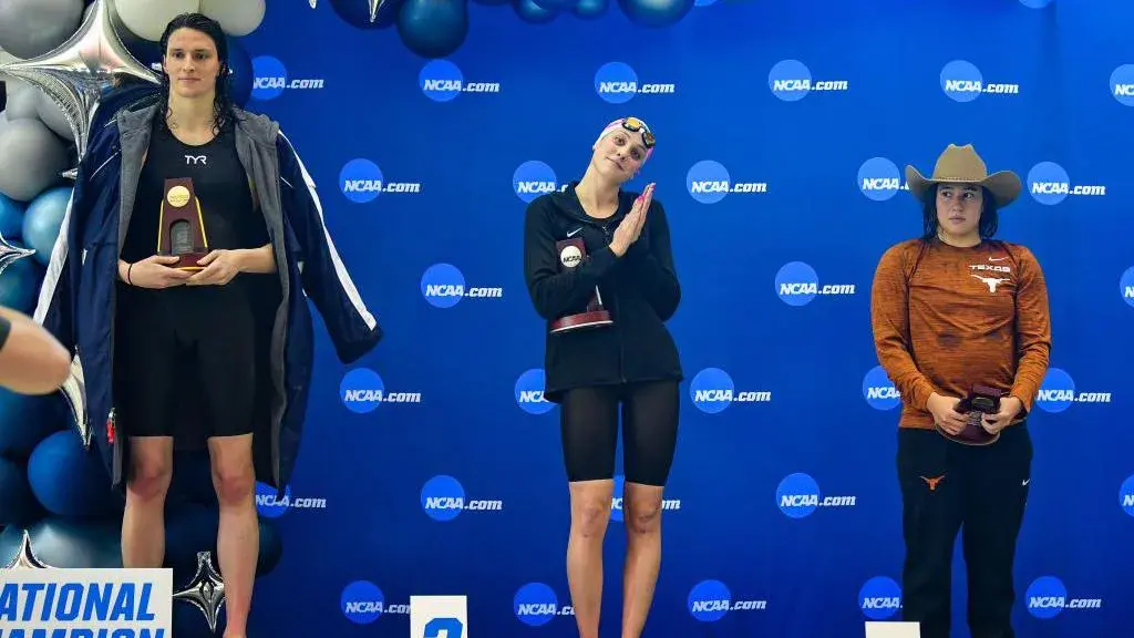 UPenn Bans Transgender Athletes – Lia Thomas Stripped of Titles 1 Lia Thomas (left) accepts the trophy at the NCAA championships in 2022. (Credit: Getty Images)
